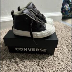 Lightly use converse high top sneaker. Practically brand new. Never walked in